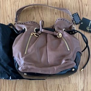 B Makowsky new leather and patent drawstring bag